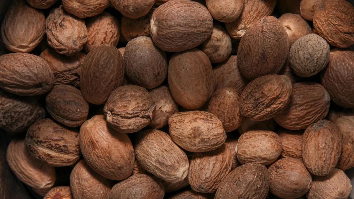Whole shelled nutmeg seeds, representative photograph